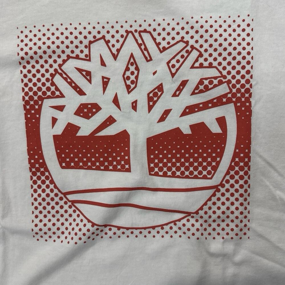 This solid white T-Shirt with a bold front Timberland logo print  - Size: XL